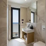 Villa Beachfront Luxury Luce, Featuring A Heated Pool, Fitness Area, And Sauna