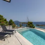 Beachfront Luxury Luce, Featuring A Heated Pool, Fitness Area, And Sauna