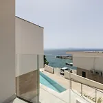 Beachfront Luxury Luce, Featuring A Heated Pool, Fitness Area, And Sauna Villa