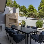 Beachfront Luxury Luce, Featuring A Heated Pool, Fitness Area, And Sauna Villa