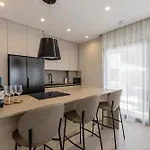 Villa Beachfront Luxury Luce, Featuring A Heated Pool, Fitness Area, And Sauna