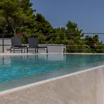 Beachfront Luxury Luce, Featuring A Heated Pool, Fitness Area, And Sauna