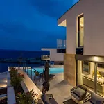 Beachfront Luxury Luce, Featuring A Heated Pool, Fitness Area, And Sauna