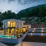 Beachfront Luxury Luce, Featuring A Heated Pool, Fitness Area, And Sauna