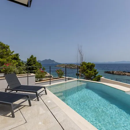 Beachfront Luxury Luce, Featuring A Heated Pool, Fitness Area, And Sauna