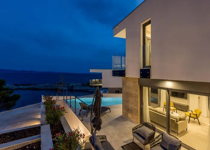 Beachfront Luxury Luce, Featuring A Heated Pool, Fitness Area, And Sauna